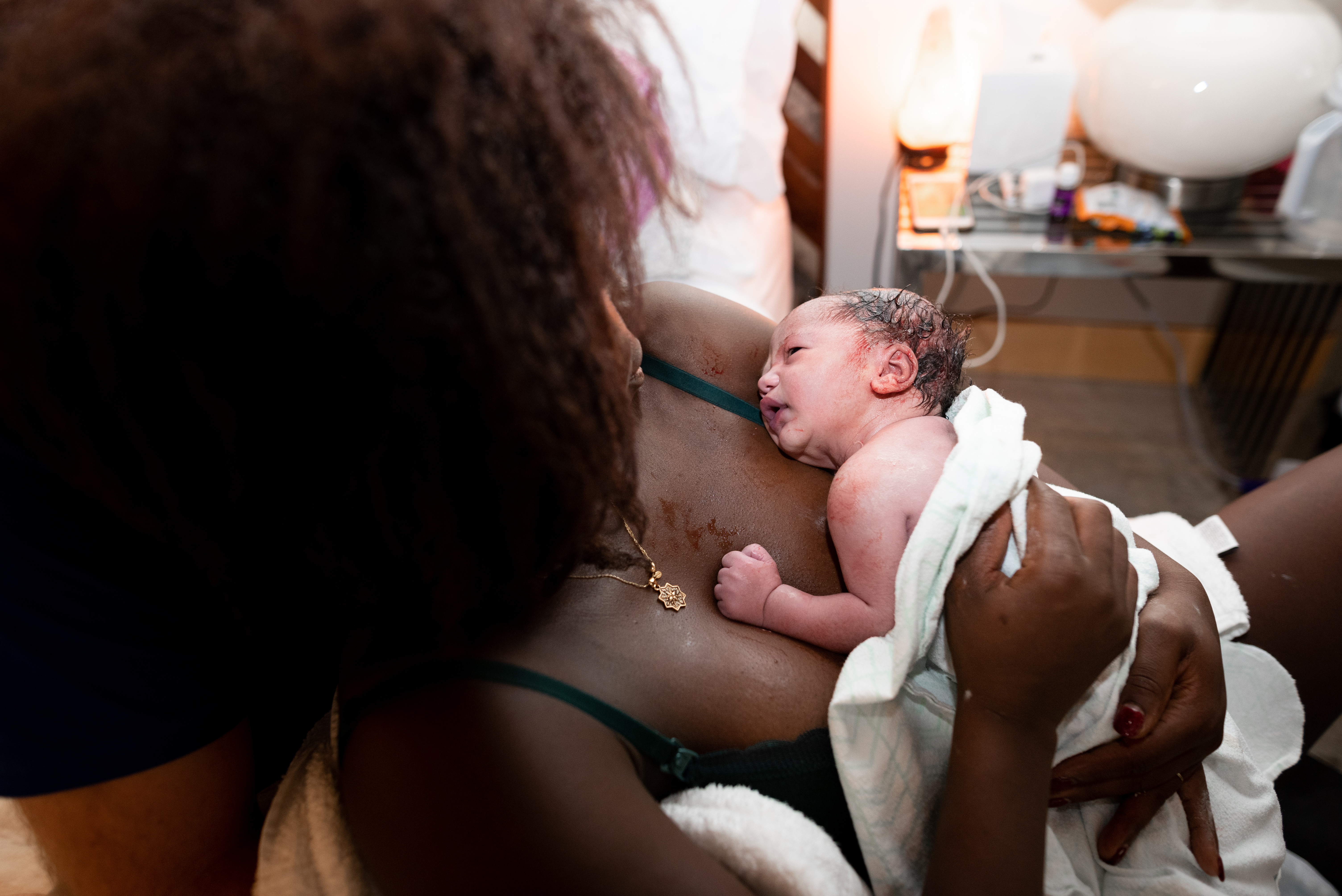 Son lies on his mother's chest after birth