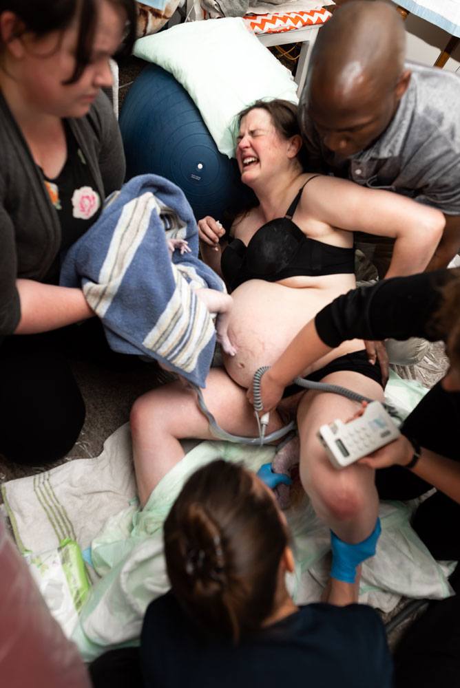 Mother pushed through contraction as baby B is born footling breech at home