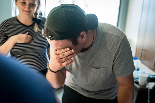 Dad cries as his daughter is born