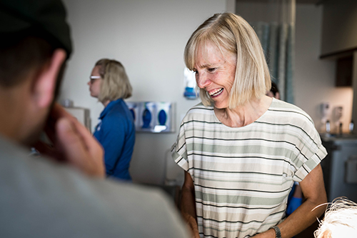Grandma smiles as her granddaughter is born